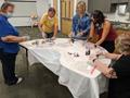 Primary view of [Manatee County Public Library System: Palmetto Branch Library staff painting face masks]