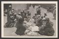 Postcard: [Bolivian people wearing hats and sitting on the ground]
