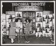 Photograph: [Enid Justin and others next to a Nocona Boot Display]