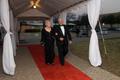 Photograph: [Man and woman walk down red carpet at 2008 Emerald Ball]