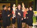Primary view of [Woman poses with Thai puppets, 1]