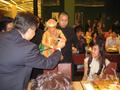 Primary view of [Man exchanges money with Thai puppet]