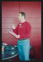 Photograph: [Man in a red Old Navy shirt: Lone Star Ride 2003 event photo]