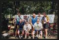 Photograph: [Cyclists posed in front of an LSR banner: Lone Star Ride 2003 event …