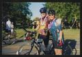 Photograph: [Cyclist #145 embracing another cyclist: Lone Star Ride 2003 event ph…