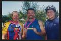 Photograph: [Cyclists Tom, Dale and Adain posing together holding a tube of creme…