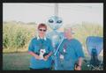 Photograph: [Duo with a blue alien blow up: Lone Star Ride 2004 event photo]