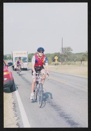 Primary view of object titled '[Cyclists on the road: Lone Star Ride 2004 event photo]'.