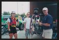 Photograph: [Trio unloading a bike: Lone Star Ride 2004 event photo]