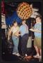 Photograph: [Three individuals covered in pie: Lone Star Ride 2001 event photo]