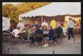 Primary view of [Banquet tables set up outside a large white pavilion tent: Lone Star Ride 2001 event photo]
