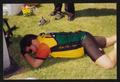 Thumbnail image of item number 1 in: '[Cyclist taking a nap on the grass: Lone Star Ride 2001 event photo]'.