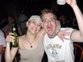 Photograph: [Man and woman pose with drinks at Vicky G. Moerbe tribute concert]