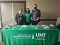 Photograph: [Three representatives of the UNT College of Information at the New E…