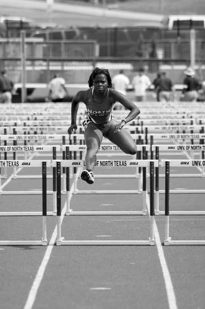 Primary view of object titled '[Araine McWhinney jumps hurdles at Brooks/NT Spring Classic, 2]'.