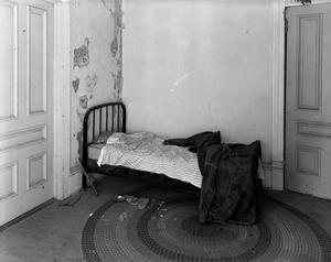 Primary view of object titled '[A bed in the upstairs portion of Daddio's Jazz Café]'.