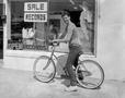 Photograph: [Photograph of a man with his bike]