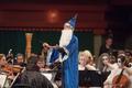 Primary view of [Close-up of the Symphony Orchestra conductor dressed as a wizard at the Spooktacular Performance]