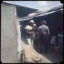Photograph: [Four people at a market in Sucre]