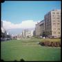 Photograph: [Trimmed grass and multiple buildings in Santiago]