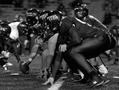 Photograph: [UNT football players in position during Troy game]