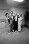 Photograph: [Jimmy Swaggart and Mike Evans with Two Women]