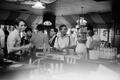 Photograph: [Men converse at Atlanta bar]