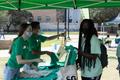 Photograph: [Student Government Association passing out t-shirts, 2]