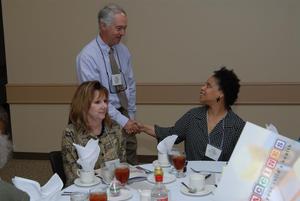 Primary view of object titled '[Stan Ingman shakes hands with Judy Fullylove at 2006 SVCI Luncheon]'.