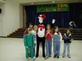 Photograph: [Children pose with Cat in the Hat at ILD event]