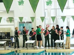 Primary view of object titled '[UNT women's swim team receives flowers after New Orleans match]'.