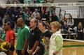 Photograph: [UNT volleyball players and coaches pose with flowers, 1]
