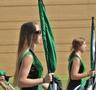 Photograph: [Green Brigade Color Guard walks 2011 Homecoming Parade]