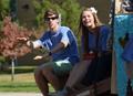 Photograph: [Students converse on 2012 Homecoming float]
