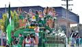 Primary view of [NT Cheerleaders ride float at 2012 Homecoming Parade]