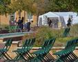 Primary view of [Members set up chairs at Fashion at the Fountains 2011]