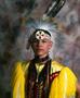 Primary view of [An Indigenous American in traditional powwow clothing]
