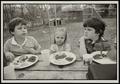 Photograph: [Byrd V, Lindsay Marshall, and Jimmy Simpler Jr. eating at a picnic]