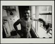 Photograph: [A boxer posing in his gym in London, UK]