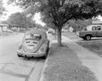 Photograph: [Neighborhood street featuring a Volkswagen]
