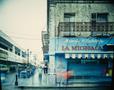 Photograph: [La Michoacán store at the entrance to a market area in color]