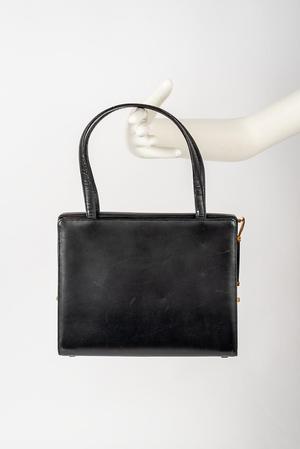 Primary view of object titled 'Black leather handbag'.