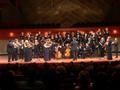 Photograph: [The UNT Collegium Singers and Baroque Orchestra performing onstage]