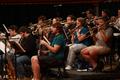 Thumbnail image of item number 1 in: '[Trombone players sitting behind bass clarinetists]'.
