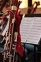 Photograph: [A bassoon with a red bow attached to it]
