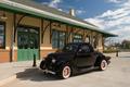 Primary view of [Vintage Charm: Classic Black Car at the Mineola Historical Museum on US ROUTE 80]
