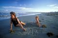 Primary view of [Joyful Moments at Galveston Beach: A Mother and Her Son]