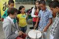 Photograph: [Students play drums during UNT trip to Colombia]