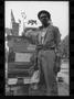 Photograph: [Street Vendor in Front of his Cart]