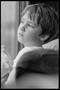 Photograph: [Child Looking Out of a train Window]